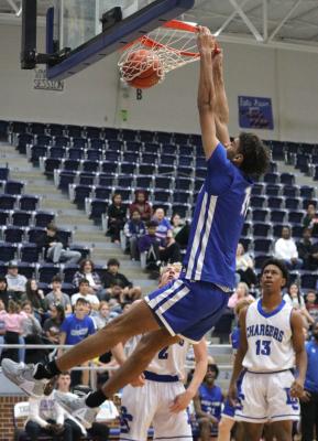 Kody Alexander delivered a pair of thunderous dunks during the second half of Wills Point’s 63-30 win over Dallas Christian Dec. 10. Alexander finished the contest with 8 points, 10 rebounds, four blocks and a steal. Photo by David Kapitan