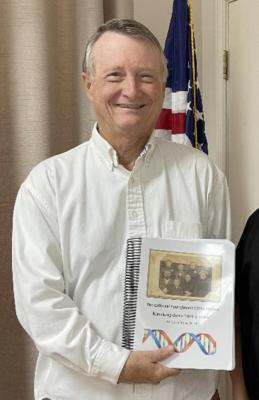 Larry Youngblood, speaker at the June 25 meeting and administrator of the Youngblood YDNA Project, with his book. Courtesy photo