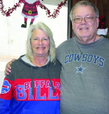 Prior to kickoff Dec. 17 between the Dallas Cowboys and the Buffalo Bills, two Van Zandt Newspapers L.L.C. employees, Senior Reporter David Barber and Accounting Assistant Teresa Patterson, left no doubt who they were rooting for in the game. After the Bills beat the Cowboys, 31-10, only one of these individuals was still smiling. Photo by Tiffany Hardy